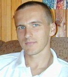 Tomasz Miko�