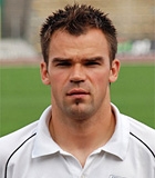 Tomasz Rog�
